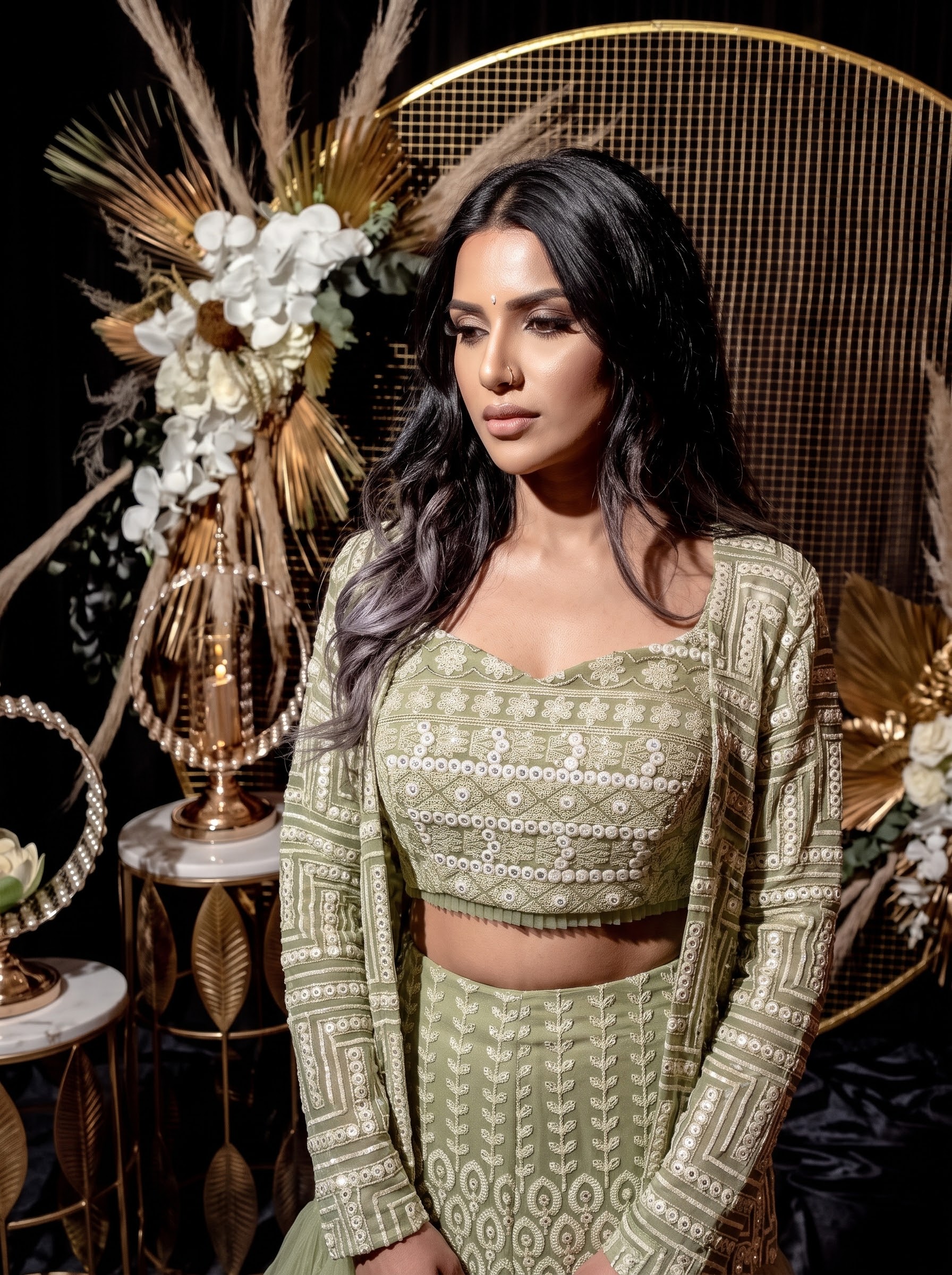 Sage green embellished gharara set with a layered tulle-ruffled jacket
